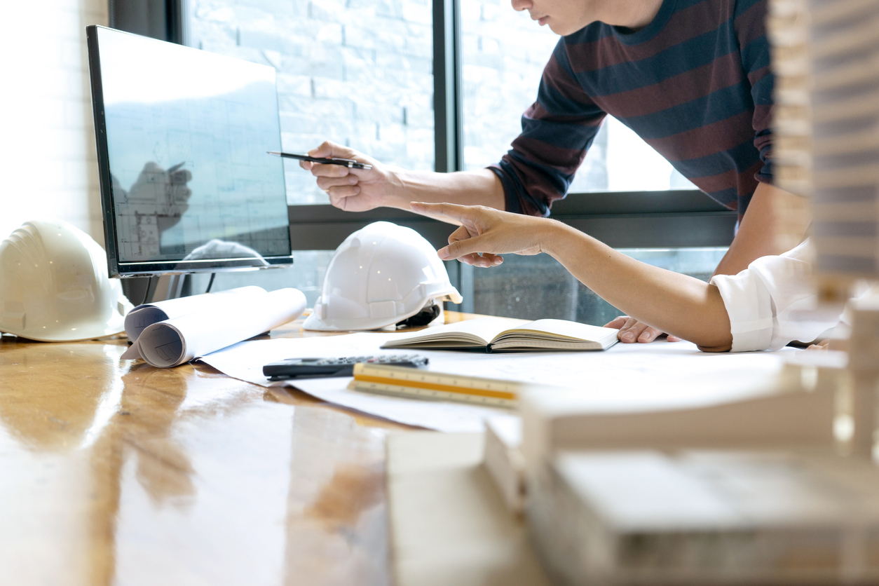 Two city employees working on a desktop