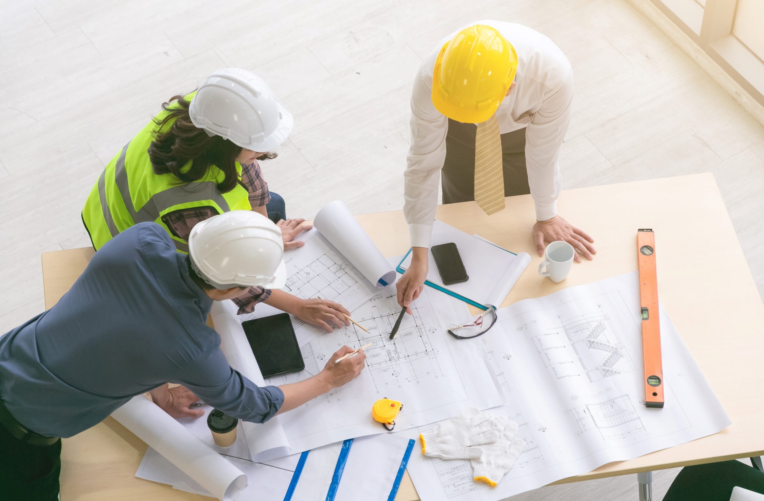 Three planning and development employees working on a building project